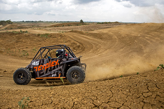 guest driving a utv on the track at Texplex Park